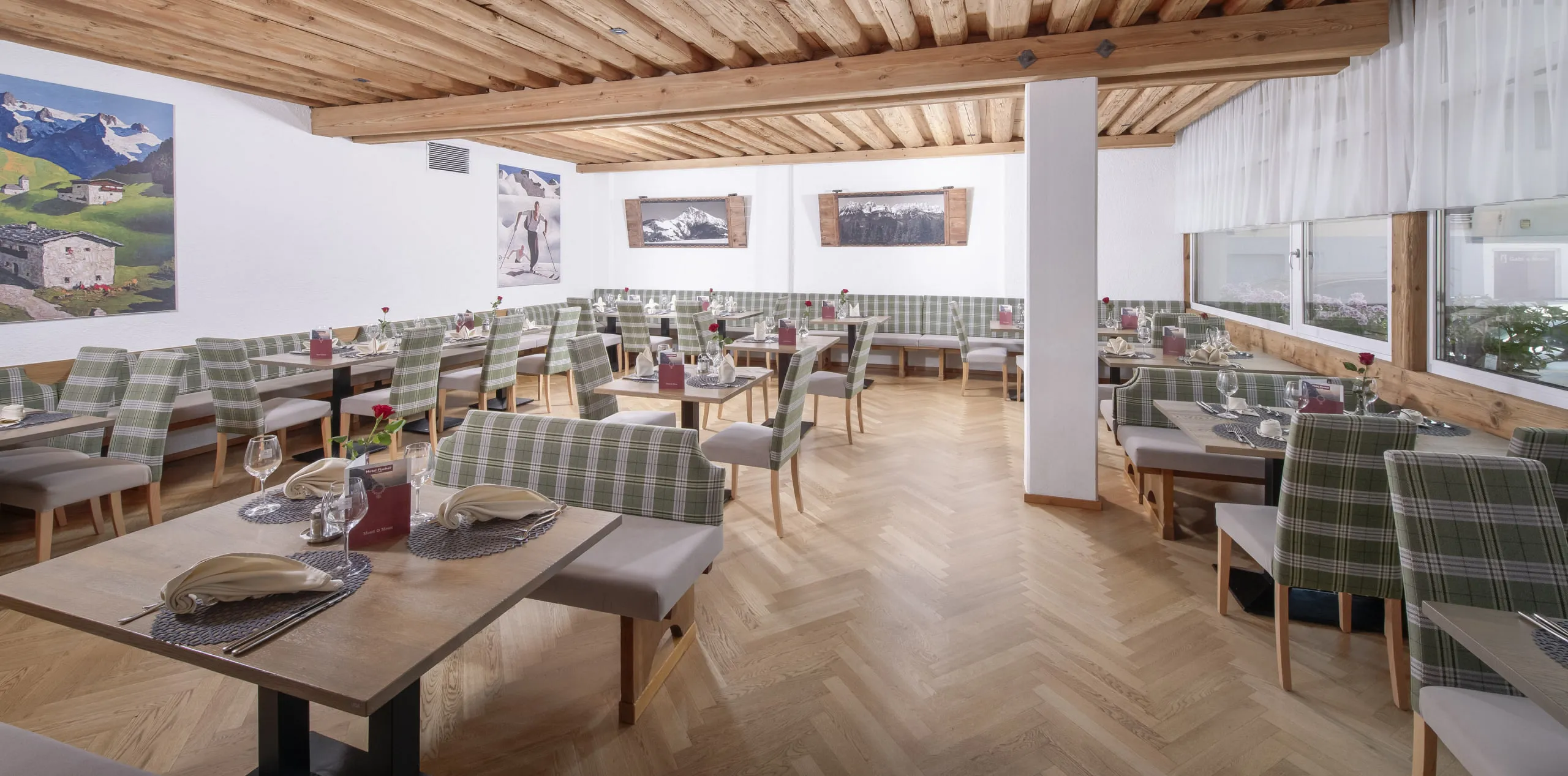 Dining hall with wooden beam ceiling and elegant tables
