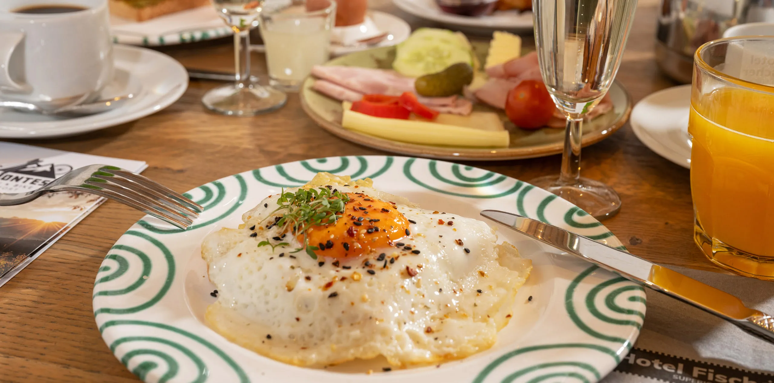 Breakfast plate with fried egg and assorted food items