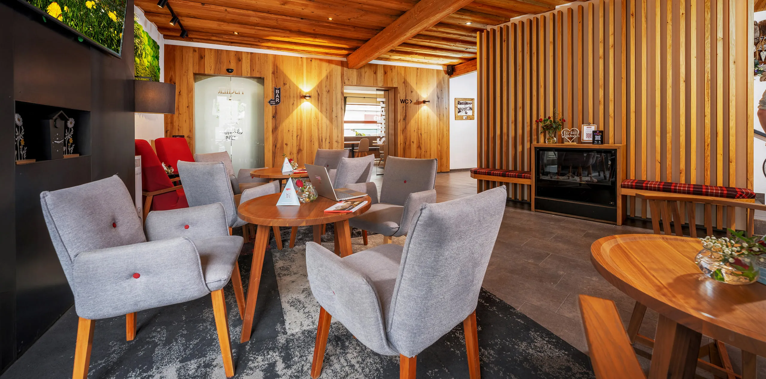 Cozy lobby with wooden details and modern furniture